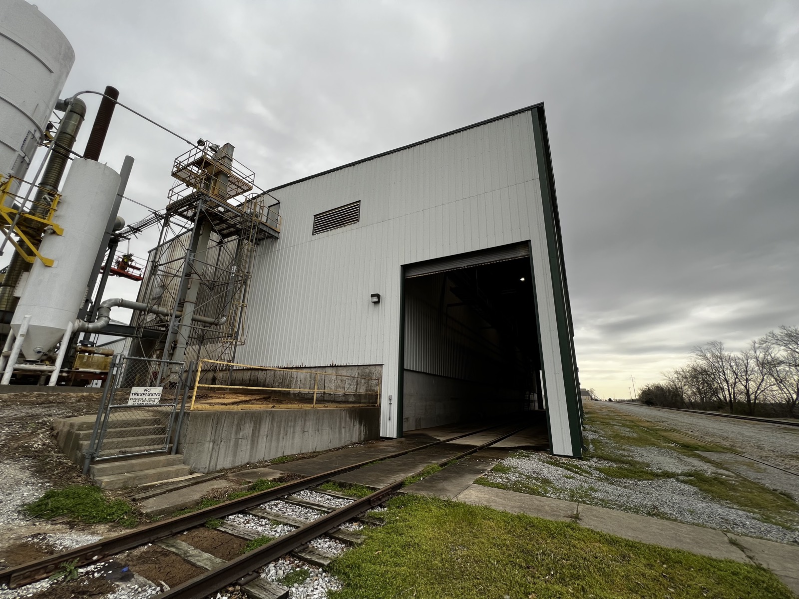 Metal industrial building after washing, clean white siding