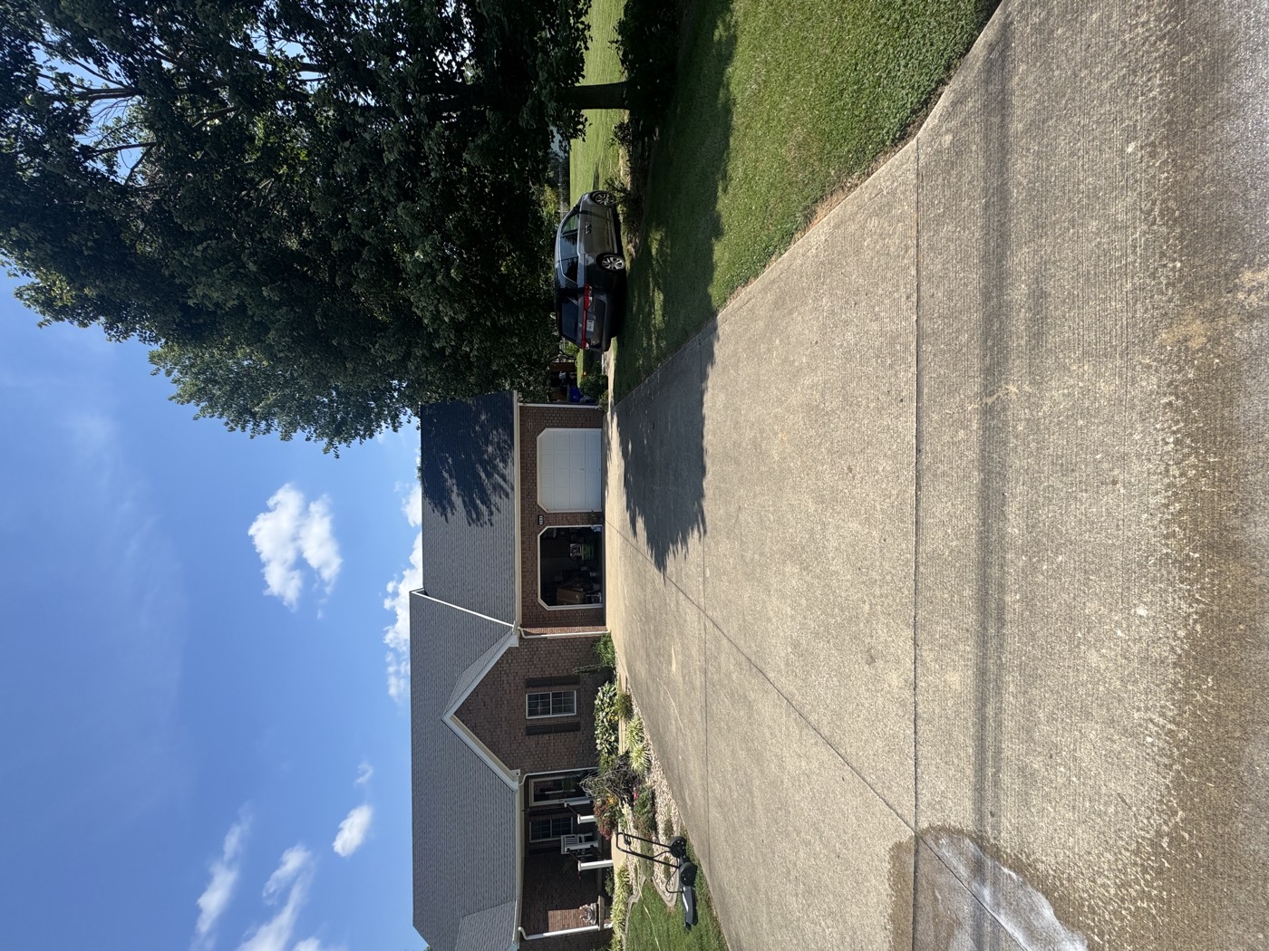 Stained concrete driveway before washing