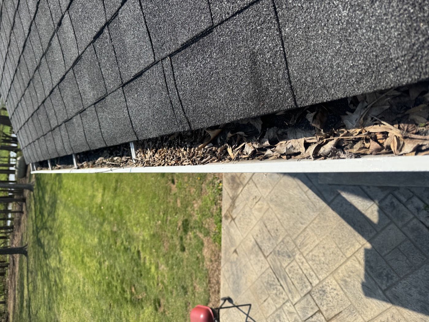 Gutter packed with leaves and debris