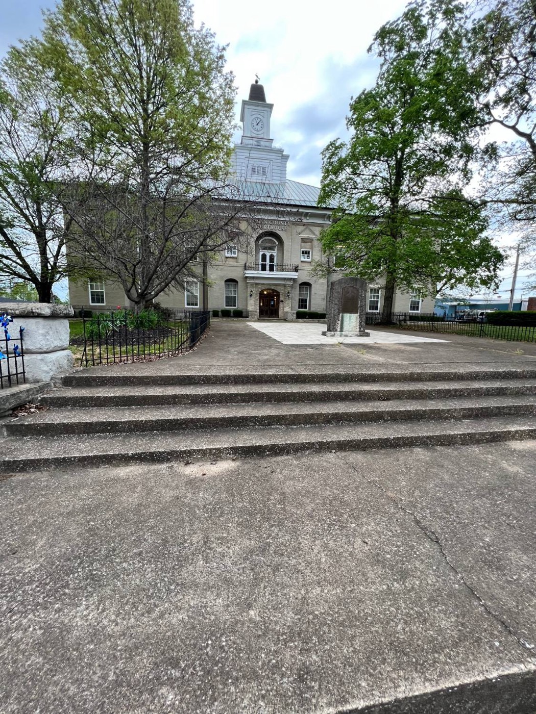 Courthouse plaza and steps before cleaning, gray and stained