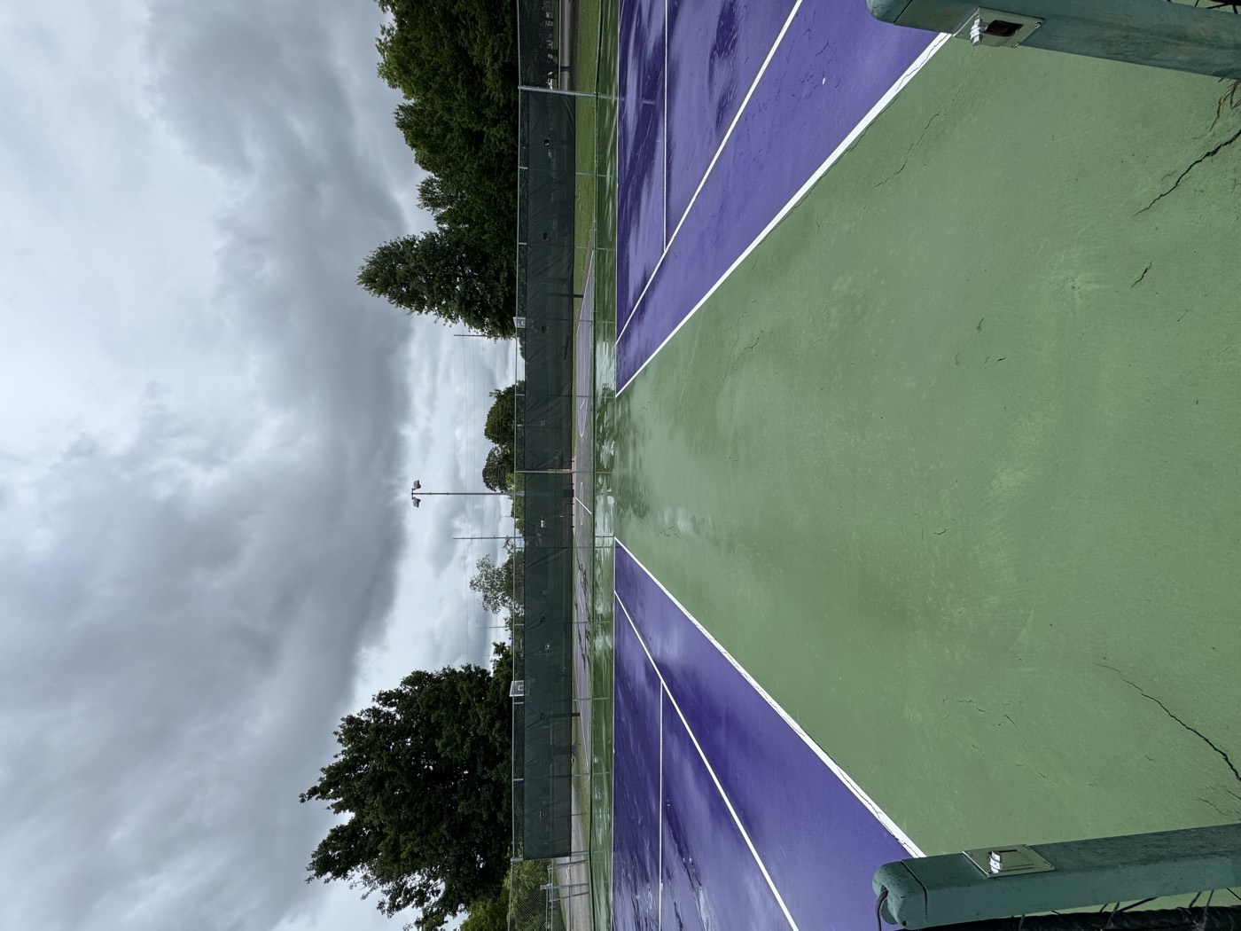 Tennis court after washing, bright green and purple